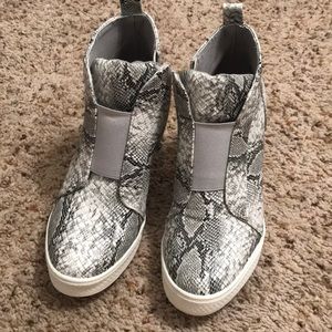 Snakeskin sneaker wedges.